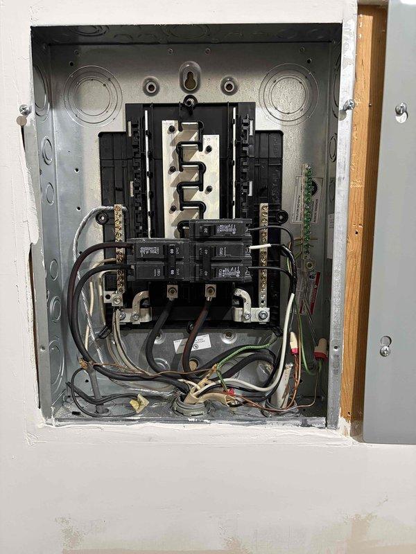 Responded to failed electrical inspection for improper grounding configuration in main service panel. Removed incorrect bonding jumper between neutral and ground bars, then relocated ground wire from neutral bar to dedicated ground bar per NEC requirements. Verified all grounding conductors properly terminated to ground bar and neutral conductors isolated to neutral bar only, ensuring proper separation of grounded and grounding conductors. Panel now complies with code requirements for re-inspection.