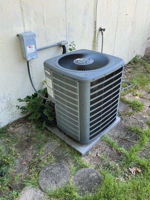 Responded to no cooling call for residential 10-year-old AC system. Upon arrival, provided 30-minute advance notice as requested by customer. Performed diagnostic evaluation of outdoor condensing unit and indoor air handler. Outdoor unit showed normal physical condition with proper placement on concrete pad and functional disconnect box. Indoor unit inspection revealed significant deterioration of heat exchanger components with extensive corrosion, rust accumulation, and yellow staining throughout. Heat exchanger tubes displayed orange-brown rust patches and discoloration indicating advanced age and possible moisture exposure. Interior cabinet showed substantial dirt buildup, rust stains, and greenish-gray deposits on metal surfaces. Wiring bundles and electrical connections were inspected and found intact. Documented conditions with photos for customer review. System age and observed deterioration of critical components noted for discussion of repair versus replacement options.