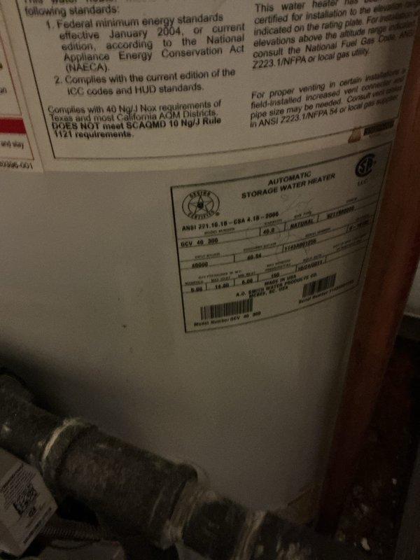 Responded to water leak in ceiling at condominium building. Removed existing failed water heater and installed new 40-gallon gas tall water heater with drain pan. Connected copper supply lines with brass fittings and shut-off valves to water heater inlet and outlet. Installed pressure relief valve and discharge piping per code requirements. Connected closet-vent system with proper venting configuration using galvanized ductwork. Applied required plumbing identification sticker and obtained permit compliance for installation. Tested all connections for leaks, verified proper gas combustion, and confirmed water heater operation. System functioning properly upon completion.