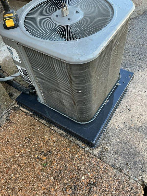 Responded to no cooling complaint on residential air conditioning system located at rear of property. Upon arrival, found outdoor condenser unit with heavy accumulation of dirt, dust, and debris coating exterior panels and coil surfaces, significantly restricting airflow and heat transfer capability. Performed thorough inspection and cleaning of condenser coils and exterior surfaces to restore proper airflow. Unit tested and verified operational following service. System returned to normal cooling operation.