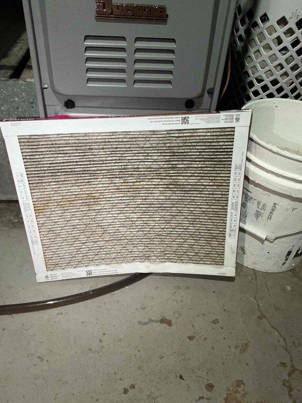 Responded to no cooling complaint on residential air conditioning system. Upon inspection, found outdoor condenser unit operational but severely restricted airflow due to critically clogged air filter at indoor air handler. Filter exhibited heavy dirt and debris accumulation throughout pleated media, causing significant reduction in system airflow and cooling capacity. Replaced dirty filter with new filter to manufacturer specifications. Verified proper airflow restoration and system cooling operation. Unit returned to normal cooling function upon completion.