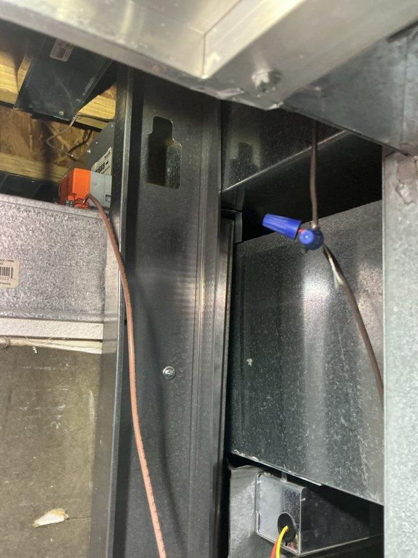 Responded to cooling and humidity complaint on 2-year-old Lennox system. Upon inspection, accessed air handler compartment and verified equipment model and serial number documentation. System was not maintaining set temperature in affected zone, with elevated humidity levels present. Performed diagnostic evaluation of internal components and wiring connections within the air handler cabinet to identify root cause of inadequate cooling performance.