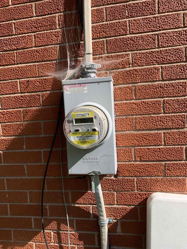 Responded to service call for non-functioning electrical outlets at downstairs pool area. Upon inspection, traced power supply from main electrical panel through exterior-mounted weatherproof outlet box on deteriorated wall surface. Verified proper connections at meter enclosure and tested circuit continuity through white PVC conduit runs. Reset tripped GFCI protection, restored power to all affected outdoor receptacles, and confirmed full functionality of downstairs pool area outlets for customer's electrical tool usage.