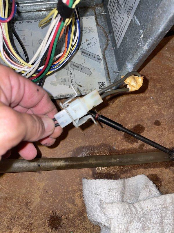 Responded to emergency no-cooling call with indoor temperature at 90 degrees. Upon arrival, found outdoor condenser unit shut off. Performed diagnostic inspection of 10-year-old split system located on side of home. Identified failed electrical connection at condenser control board causing system shutdown. Disconnected and replaced damaged wire connector, secured all low-voltage wiring connections, and restored power to unit. Verified proper operation of condenser fan motor and compressor startup. System cooling normally upon departure with indoor temperature dropping.