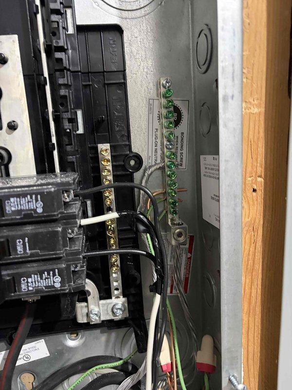 Returned to property to address failed inspection items on previous electrical installation. Corrected deficiencies in main electrical panel including proper wire terminations, organized and secured grounding conductors to grounding bar per code requirements, and ensured all circuit breaker connections met NEC standards. Inspected and remediated loose or improper wire connections at terminal blocks, removed damaged wire material, and verified all electrical connections were tight and properly torqued. All corrections documented with photographs for inspection approval.