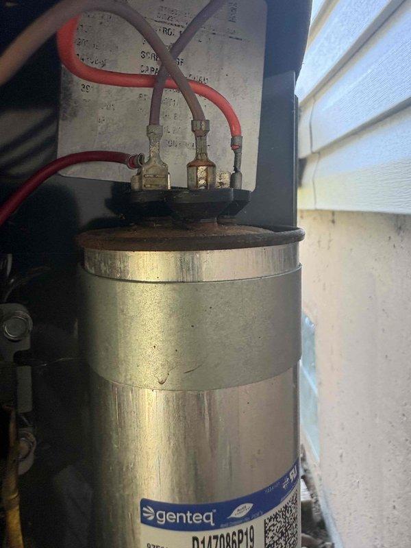 Responded to service call for 10-year-old Trane system running but not cooling to setpoint. Upon inspection, diagnosed failed dual run capacitor preventing proper compressor and condenser fan motor operation. Replaced defective Genteq capacitor with manufacturer-approved replacement, verified proper microfarad ratings, and tested all electrical connections at contactor. System restored to full cooling capacity with proper amperage draw on both compressor and fan motor circuits.