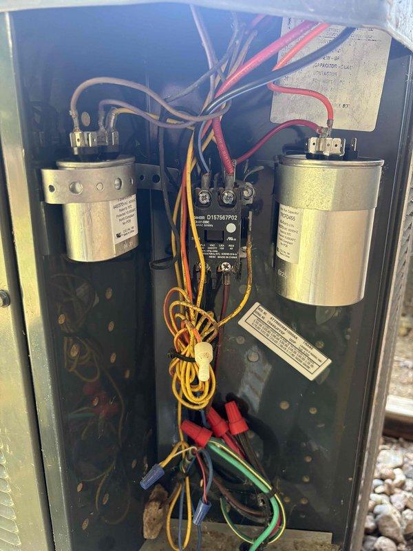 Responded to service call for 10-year-old Trane system running but not cooling to setpoint. Upon inspection, diagnosed failed dual run capacitor preventing proper compressor and condenser fan motor operation. Replaced defective Genteq capacitor with manufacturer-approved replacement, verified proper microfarad ratings, and tested all electrical connections at contactor. System restored to full cooling capacity with proper amperage draw on both compressor and fan motor circuits.