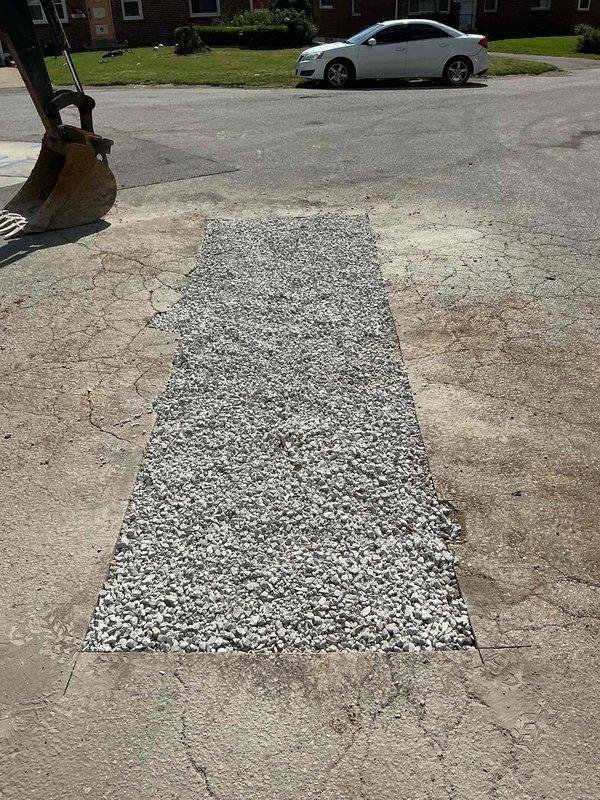Completed sewer lateral repair in coordination with City of Overland permit PSL26-0045. Excavated and replaced damaged section of sewer lateral line, installed new PVC piping, and restored pavement surface with exposed aggregate material. Backfilled excavation area and ensured proper compaction before surface restoration was completed.