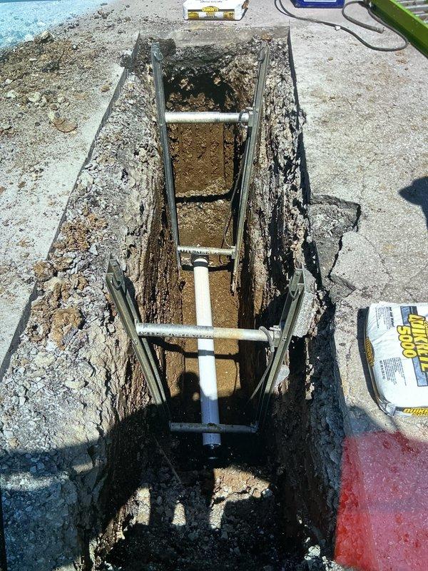 Completed sewer lateral repair in coordination with City of Overland permit PSL26-0045. Excavated and replaced damaged section of sewer lateral line, installed new PVC piping, and restored pavement surface with exposed aggregate material. Backfilled excavation area and ensured proper compaction before surface restoration was completed.