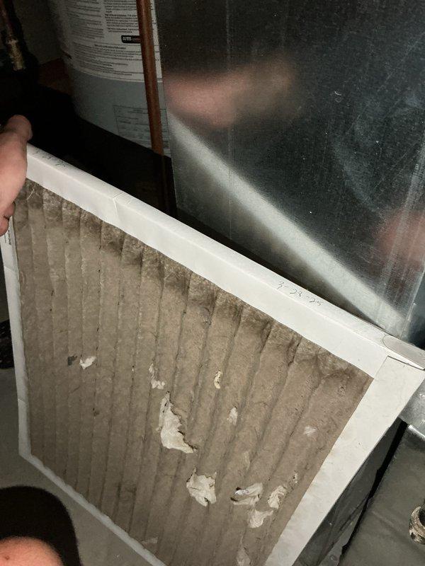 Completed comprehensive tune-up and maintenance on 10-year-old residential air conditioning system with outdoor condensing unit. Replaced heavily contaminated air filter that showed significant dust and debris accumulation throughout pleated media. Performed complete system diagnostics using refrigerant manifold gauges, recording operating pressures of 132.1 PSIG high side and 40.73 PSIG low side with superheat and subcooling measurements confirming proper refrigerant charge and system performance. All components inspected and system operating within normal parameters.