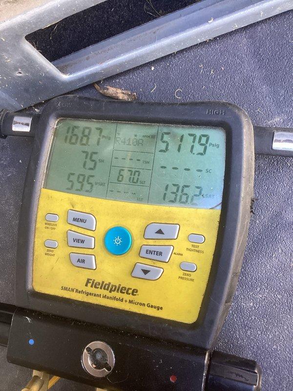 Responded to service call for air conditioning unit experiencing short cycling with fan operational. Upon inspection, found condenser coils heavily contaminated with dirt, dust, and debris causing restricted airflow and system inefficiency. Removed side access panel and documented extensive buildup on condenser fins and coils. Performed diagnostic testing using refrigerant manifold gauge to verify system pressures and temperatures. The severe contamination was identified as the primary cause of the cycling issue, as restricted airflow prevented proper heat exchange and triggered high-pressure safety cutoffs.