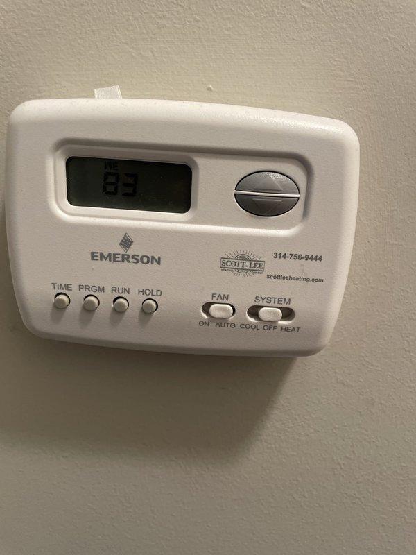 Responded to no cooling complaint on 10-year-old residential air conditioning system. Upon inspection, found outdoor condenser unit's intake filter completely blocked with heavy accumulation of dirt, dust, and debris, severely restricting airflow to the system. Removed and cleaned clogged filter, restoring proper airflow to condenser unit. Verified thermostat was set to cooling mode and confirmed system returned to normal operation with cold air delivery restored.