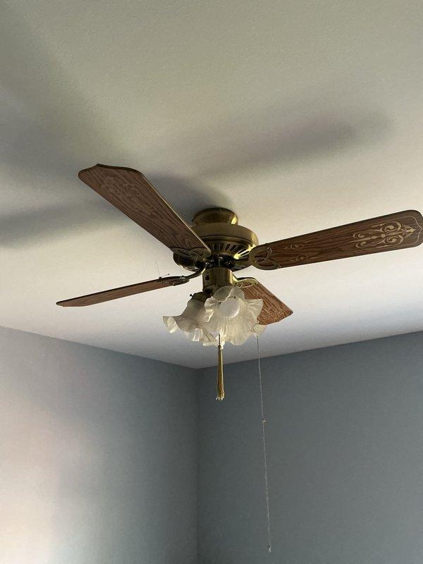 Completed electrical estimate for installation of three ceiling fans in two bedrooms. Site assessment confirmed existing electrical boxes and wiring capacity for fan installations. Documented current ceiling configurations including standard flat ceiling in one bedroom and vaulted ceiling with exposed beams in second bedroom, which will require appropriate mounting hardware and downrod extensions for proper clearance and operation.