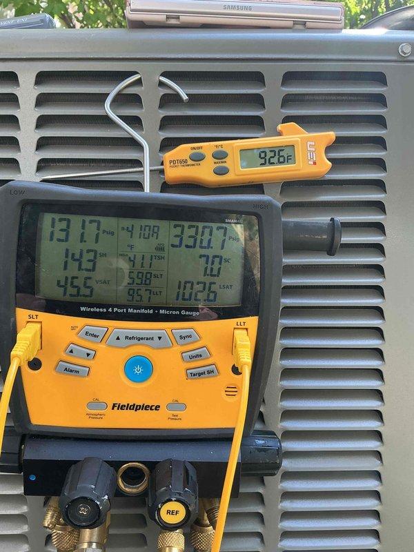 # HVAC Cooling System Tune-Up Summary

Performed comprehensive preventive maintenance on ground-mounted air conditioning unit. Inspection revealed moderate dust accumulation on blower motor assembly and electrical components requiring attention.

# Work Performed

Conducted thorough visual inspection of electrical control compartment, verifying all wire connections, contactor operation, and capacitor condition. Examined control board terminals and wiring integrity throughout upper compartment. Assessed blower motor assembly, noting dust buildup on motor housing and surrounding cabinet areas.

Performed operational diagnostics using calibrated test equipment. Measured system pressures and temperatures with digital manifold gauge set, recording refrigerant pressures and superheat values. Monitored supply air temperature at grille, confirming proper airflow and cooling performance. All readings indicated system operating within manufacturer specifications.

Cleaned blower motor housing an