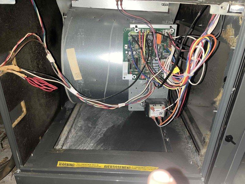 Completed cooling season tune-up on 12-year-old basement air conditioning unit. Performed comprehensive system inspection including blower motor assembly, control board connections, and electrical components; all wiring connections verified secure with no signs of overheating or damage. Inspected existing air filter showing moderate dust accumulation and recommended replacement to maintain optimal airflow and system efficiency.