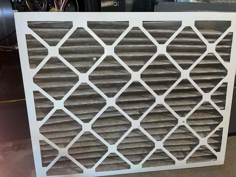 Completed cooling season tune-up on 12-year-old basement air conditioning unit. Performed comprehensive system inspection including blower motor assembly, control board connections, and electrical components; all wiring connections verified secure with no signs of overheating or damage. Inspected existing air filter showing moderate dust accumulation and recommended replacement to maintain optimal airflow and system efficiency.