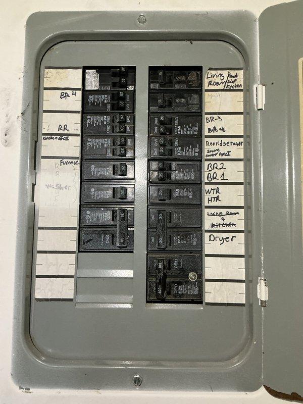 Completed electrical estimate for sub panel installation at residential property. Evaluated existing main electrical panel, which contains two columns of circuit breakers serving various household circuits including HVAC, water heater, kitchen appliances, bedrooms, and living areas. Observed dense wiring configuration with multiple wire runs and connections throughout the existing panel enclosure. Assessed current electrical load distribution and available capacity to determine specifications and requirements for proposed sub panel installation. Documented existing panel condition and circuit layout to develop accurate scope of work and material requirements for the sub panel project.