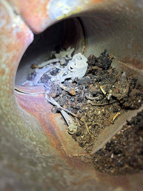 Completed flue pipe repair on residential furnace system. Removed and replaced deteriorated 10 feet of 4-inch flue pipe and installed four 4-inch elbows due to significant internal debris accumulation, corrosion, and material breakdown that compromised proper venting. System tested and confirmed operational upon completion.