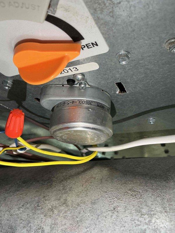 Responded to no cooling complaint on 1-year-old upstairs unit that had been constantly running. Upon arrival, unit was found in off position with fan set to on. Previous repair and adjustments had been completed in July, but system performance had progressively declined since that time. Performed diagnostic inspection of mechanical components and electrical connections in attic installation. Inspected blower motor assembly, wiring connections with wire nuts, and associated ductwork. Evaluated system controls and safety switches. Documented equipment conditions through photography for service records.