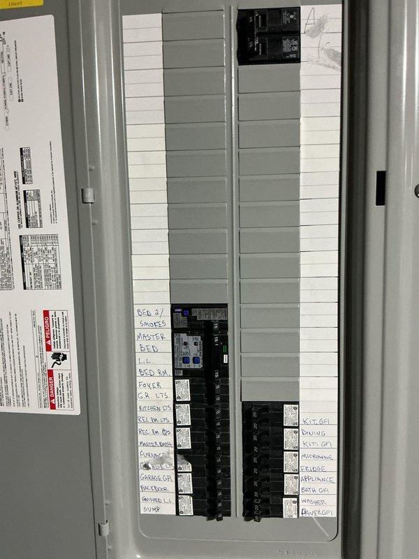 Conducted a comprehensive re-evaluation of the existing electrical system for a residential backup generator installation in response to homeowners association requirements. Performed detailed assessment of the main electrical panel, documenting current circuit configuration, available breaker spaces, and load distribution across existing circuits serving bedrooms, kitchen, garage, dining room, recreational room, and major appliances. Evaluated panel capacity and electrical infrastructure to determine compatibility with proposed generator installation and automatic transfer switch integration. Photographed electrical panel layout showing circuit identification and current breaker arrangement, as well as interior electrical conditions including recessed lighting systems. Prepared revised technical estimate documentation with updated specifications to address HOA compliance requirements and ensure proper generator sizing for the residence's electrical demands.