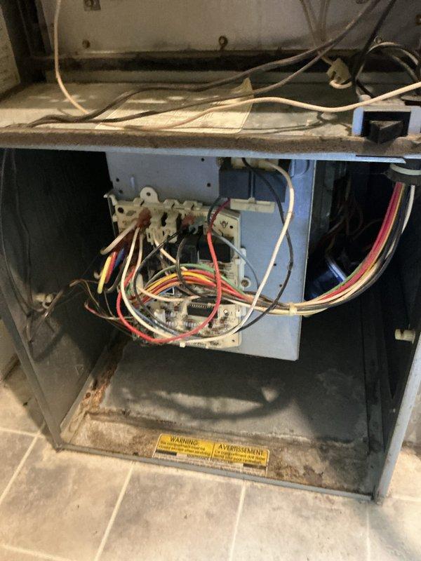 Completed comprehensive cooling system tune-up on ground-level AC unit. Performed standard maintenance procedures including inspection of air handler components, electrical connections, and refrigerant lines. All wiring connections at control board verified secure, filter access panel inspected, and copper refrigerant lines checked for proper condition. Unit operating within normal parameters upon completion.