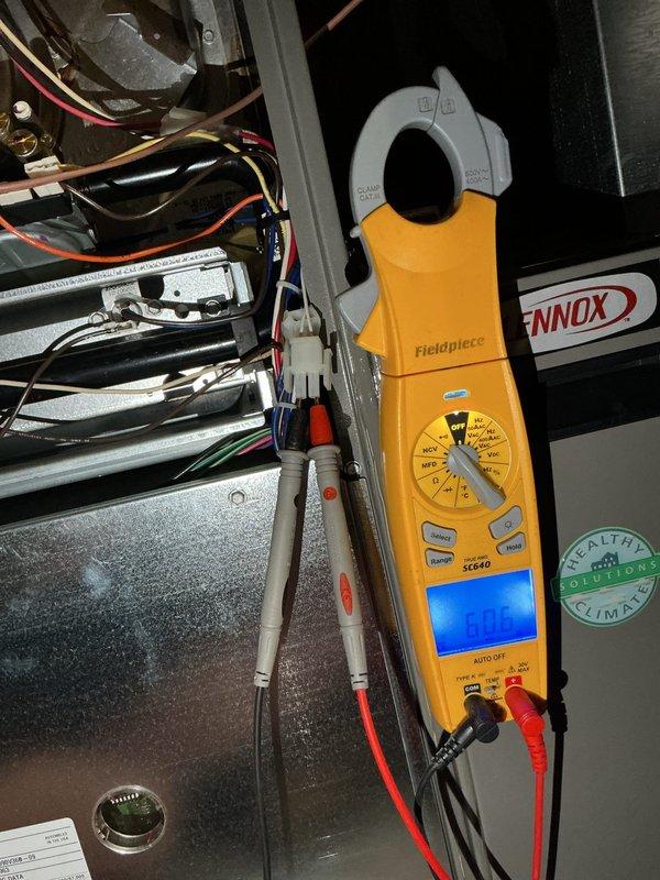 Responded to no cooling call with Lennox system displaying error code 207 "GFHS expensed open" and indoor temperature at 89°F. Upon arrival, performed diagnostic evaluation of outdoor condensing unit and indoor air handler components. Inspected condenser coil condition, which appeared clean and properly maintained. Utilized Fieldpiece SC640 clamp meter to measure electrical parameters at the air handler, checking amp draw, voltage, and system controls. Examined control board, wiring connections, and associated components for proper operation. Verified thermostat communication and system response. Photographically documented condenser unit exterior condition and electrical diagnostic measurements at air handler for service records. Addressed alarm condition and restored system to proper cooling operation, bringing indoor temperature down to comfortable levels.