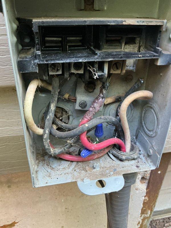 Responded to no cooling call on 24-year-old air conditioning system. Upon arrival, found outdoor unit not operating while indoor blower was running normally. Inspected outdoor disconnect box and discovered deteriorated wiring connections with significant age-related degradation, loose wire terminations, and accumulated debris within the enclosure. Identified compromised electrical connections at terminal block preventing proper power delivery to compressor and condenser fan motor. Cleaned and re-terminated all electrical connections, replaced degraded wire nuts, and secured all conductors properly within disconnect box. Verified proper voltage at unit, restored power, and confirmed compressor and outdoor fan motor operation. System cycled on properly and began cooling effectively. Recommended monitoring system performance and consideration for unit replacement due to advanced age of equipment.