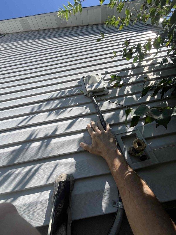 Returned to site during daylight hours to diagnose Daikin outdoor condenser unit mounted in compact, elevated wall-bracket installation with limited access. Conducted thorough visual inspection of wall-mounted unit, refrigerant line connections, and electrical components including exterior disconnect box. Completed diagnostic assessment of the system and provided detailed repair quote to customer for identified issues.
