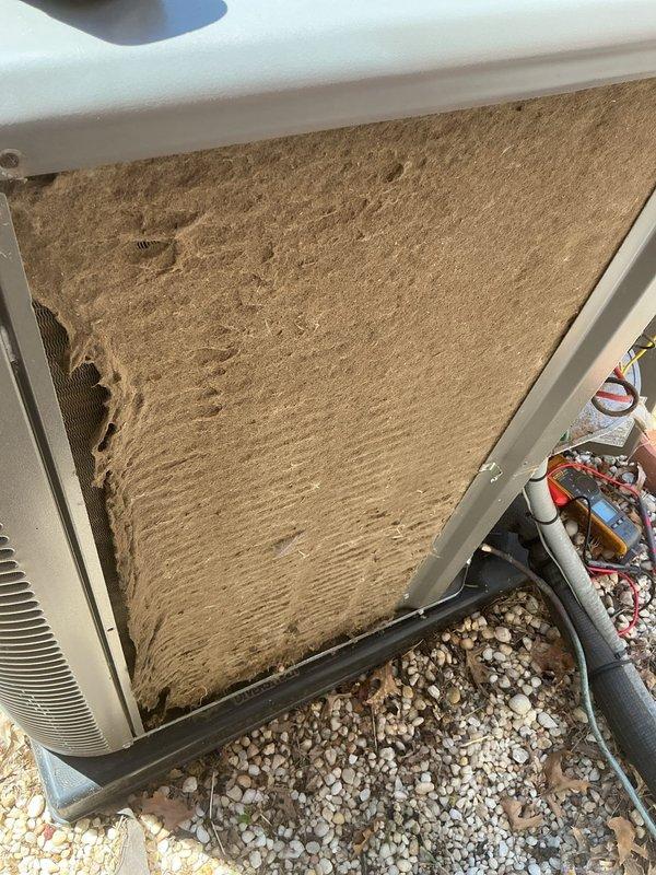 Responded to no cooling complaint on unit 10 located at side of home. Upon arrival, found outdoor condenser coil heavily restricted with thick accumulation of dust, dirt, and debris, significantly impeding airflow and heat transfer capability. Cleaned condenser coil thoroughly, removing several millimeters of caked-on buildup from fins and exterior panels. Restored proper airflow through unit. System returned to normal cooling operation following cleaning. Advised to monitor performance and recommended regular maintenance to prevent future airflow restrictions.