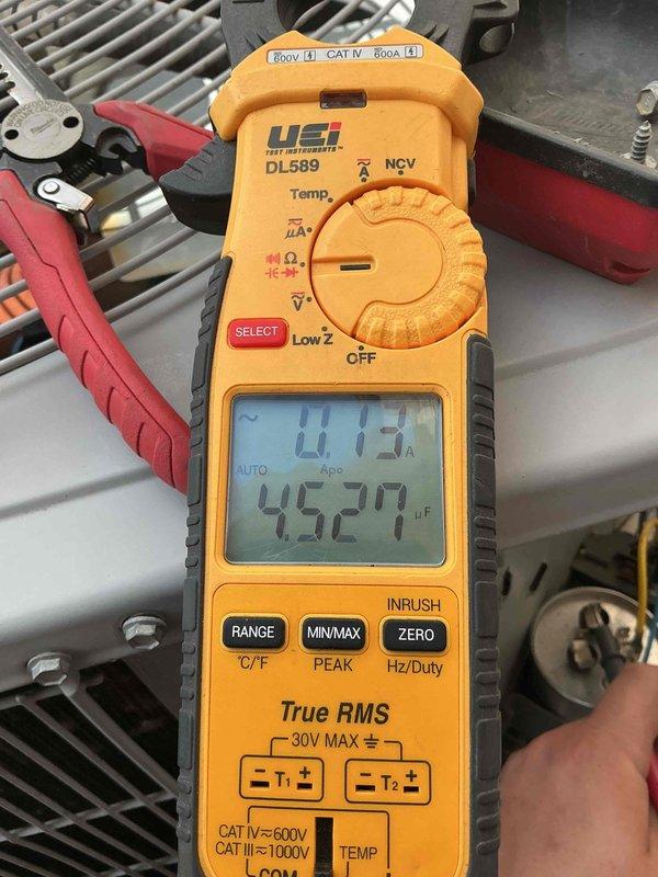 Responded to no cooling complaint on 12-year-old Carrier system with house temperature at 80°F. Upon arrival, found system running but not producing adequate cooling. Performed diagnostic testing using clamp meter to measure amperage draw and refrigerant line temperatures. Initial readings showed suction line temperature at 45.27°F with low amperage draw of 0.13A, indicating potential refrigerant issue or system restriction. Further testing revealed compressor amperage at 2.02A, which is below normal operating range for this unit size. Identified low refrigerant charge as primary cause of insufficient cooling. System exhibited classic symptoms of undercharge including abnormally low suction line temperatures and reduced compressor load. Inspected system for potential leaks and verified all electrical connections and components were functioning properly. Discussed findings and repair options with customer for system restoration.
