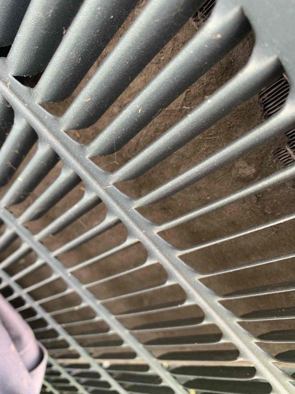 Returned to address no cooling issue on single AC unit following previous day's visit where dirty filter and coil were identified. Customer had replaced filter but did not clean outdoor condenser coil. Upon arrival, confirmed unit was off with fan running as instructed. Inspected outdoor condenser unit and documented heavily restricted coil with significant accumulation of dirt, dust, and fibrous debris blocking airflow between fins. Cleaned condenser coil to restore proper heat exchange capacity and airflow. Verified system operation and cooling performance restored to normal parameters.