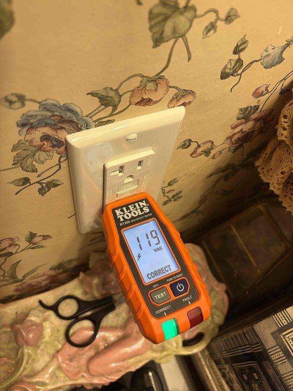 Performed comprehensive electrical estimate for outlets and breaker box installation. Conducted voltage testing on existing outlet using Klein Tools RT250 tester, confirming proper 118 VAC reading and correct wiring configuration. Assessed exterior electrical service panel, meter base, and solar power system integration including SolarEdge inverter and associated conduit routing for potential upgrade requirements.