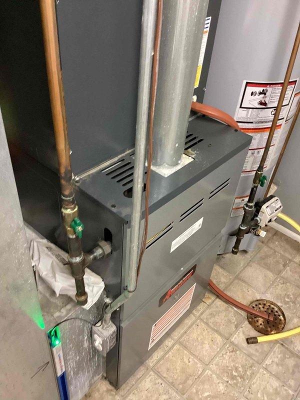 Responded to no cooling complaint on 6-year-old Amana system. Upon arrival, confirmed indoor temperature at 83°F with thermostat calling for cooling. Performed diagnostic evaluation of furnace and air conditioning components, inspecting refrigerant lines, electrical connections, and control systems. Documented equipment condition and system configuration with photos for service records.