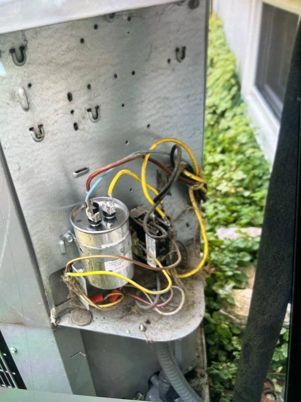 Responded to no cooling complaint on 5-year-old split system air conditioning unit. Upon inspection, found condenser coil heavily loaded with dirt, dust, and debris accumulation, significantly restricting airflow through fins. Cleaned condenser coil thoroughly to restore proper heat transfer and system efficiency. Inspected electrical components including capacitor and contactor, verified all connections secure and within specifications. Unit tested after service, confirmed adequate cooling operation and proper system function restored.