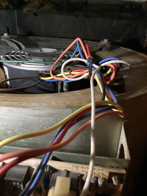 Replaced failed blower motor with OEM unit to restore cooling operation. Removed temporary rescue motor that was previously installed, completed all electrical connections with proper color-coded wiring, and verified blower assembly operation within specifications. Disposed of defective motor per standard procedures.