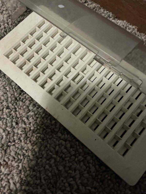 Responded to service call for iced-over condenser unit. Upon arrival, confirmed outdoor condensing unit had excessive ice buildup on coils and refrigerant lines. Advised customer to power down system immediately to prevent compressor damage and allow ice to thaw completely. Inspected interior supply registers and documented airflow conditions at multiple locations throughout the home. Found restricted airflow at floor vents with visible dust accumulation, indicating potential filter restriction or low refrigerant charge contributing to freeze-up condition. System requires follow-up visit after complete thaw to diagnose root cause, check refrigerant levels, inspect evaporator coil, verify proper airflow, and test system operation.