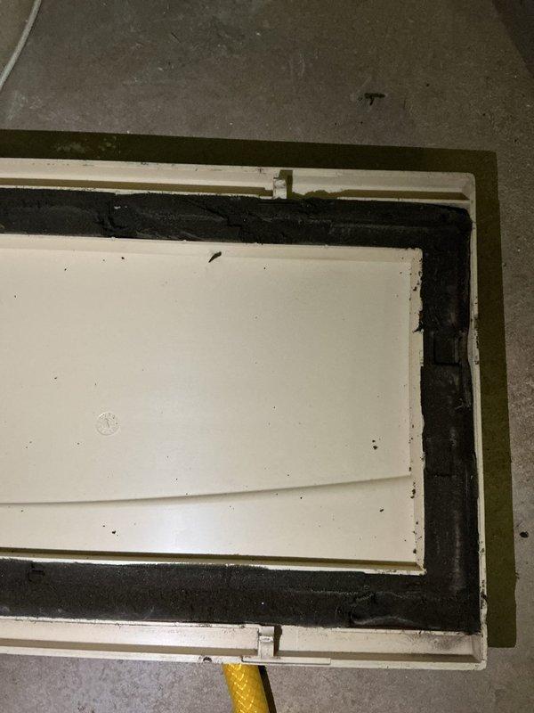 Responded to callback for whistling blower noise following previous installation. Upon inspection, confirmed all equipment had been replaced except the filter box cabinet, which was reused from original system. Installed Goodman RDSS40 communicating air handler with 600M CFM capacity, reusing existing filter cabinet as specified. Verified and confirmed intake ducting compatibility for SLP99 configuration. Installed new electrical disconnect and whip for proper power supply to unit. Documented filter box cabinet condition with photographs showing weatherstripping wear and minor deterioration along panel edges. System tested and operational upon completion of callback service.