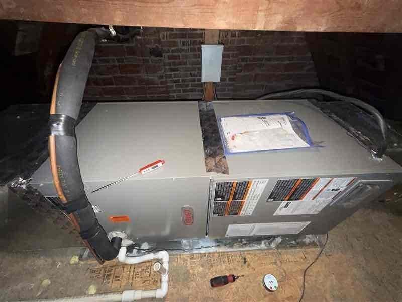 Responded to callback for second floor air conditioning failure on recently installed Lennox system (May 2024). Inspected attic-mounted air handler and associated components including refrigerant lines, condensate drainage, and ductwork connections. Documented equipment condition and configuration with photos showing unit installation, PVC drainage lines, copper refrigerant piping, and flexible ductwork in attic space. Verified system specifications and warranty status on 0-year Lennox air handler paired with 7-year condensate pump unit. Completed diagnostic evaluation and confirmed best contact number for follow-up communication.