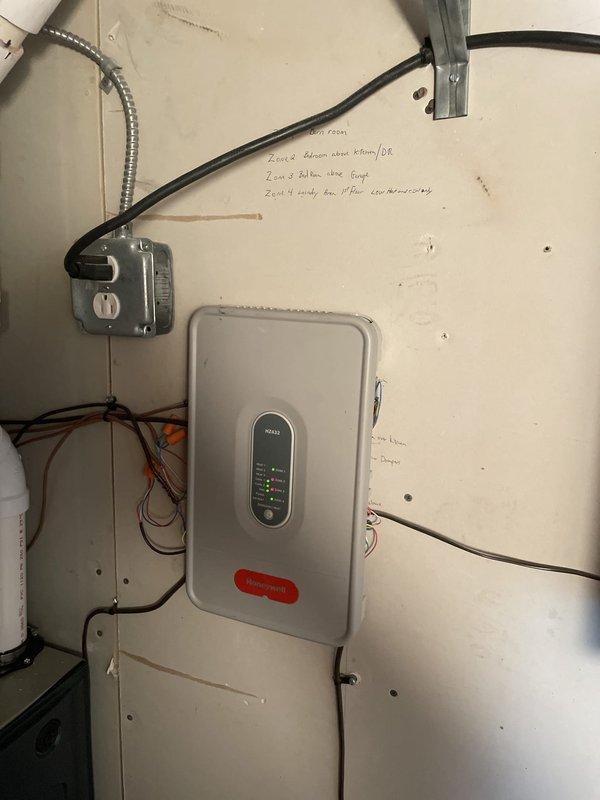 Responded to service call for non-functioning air conditioning damper system. Upon inspection, verified control panel operation and zone system configuration in mechanical room, confirmed thermostat communication with American Standard unit displaying proper temperature readings and set points. Documented existing system layout including control wiring, zone panel with indicator lights operational, and thermostat functionality at 69°F current temperature with 74°F set point, system responding appropriately at time of inspection.