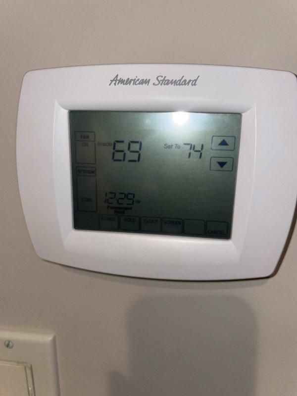 Responded to service call for non-functioning air conditioning damper system. Upon inspection, verified control panel operation and zone system configuration in mechanical room, confirmed thermostat communication with American Standard unit displaying proper temperature readings and set points. Documented existing system layout including control wiring, zone panel with indicator lights operational, and thermostat functionality at 69°F current temperature with 74°F set point, system responding appropriately at time of inspection.