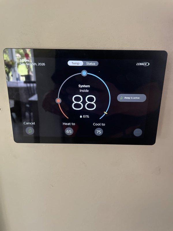 Responded to no cooling complaint on 10+ year old unit located on left side of home. Upon arrival, contacted customer per request to discuss diagnosis before proceeding. Accessed property using provided garage code. Found Lennox thermostat powered on and displaying system status, with indoor temperature reading 88°F while setpoint was 75°F in cooling mode. Thermostat showed "Away is active" mode engaged. System was not responding to cooling calls. Documented thermostat display showing high indoor temperature and humidity levels, confirming lack of cooling operation. Contacted customer to report findings and discuss repair options.