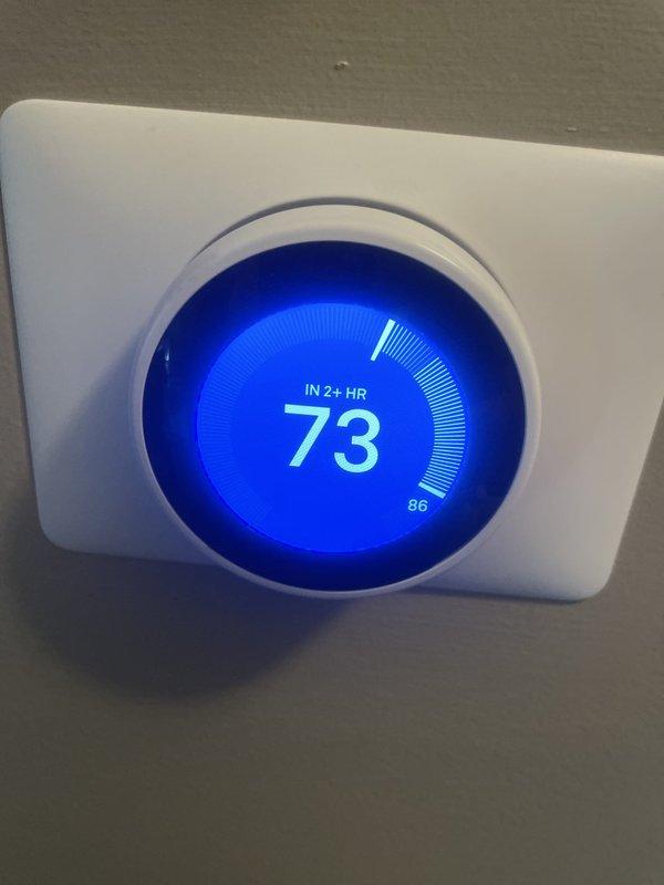 Responded to no cooling call on 10+ year old residential AC unit located on side of home. Performed diagnostic evaluation of outdoor condensing unit and indoor thermostat system. Inspected condenser fan motor assembly, which showed significant dirt accumulation and operational wear consistent with unit age. Examined condenser coil fins for blockages and airflow restrictions. Verified thermostat functionality and observed unit attempting to reach setpoint with extended runtime indicated on display. Documented equipment condition through photos for customer records and repair recommendations.