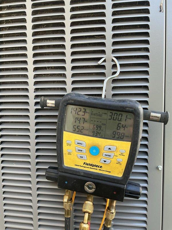 Responded to no cooling complaint on Lennox system following power outage from transformer failure. Upon arrival, found unit running but house temperature at 85°F. Diagnosed issue as thermostat programming lost during power interruption on recently installed digital thermostat. Reprogrammed thermostat to proper cooling setpoints and verified system operation. Used clamp meter to verify amperage draw on compressor and confirmed readings within manufacturer specifications. Connected manifold gauges to measure refrigerant pressures and temperatures, confirming system charging and performance parameters were correct at 142.3 PSI high side and 117 PSI low side with superheat at acceptable levels. Instructed occupant on proper thermostat operation and programming procedures to prevent future issues. System cooling properly upon departure with all components operating as designed.