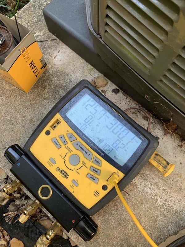 Responded to no cooling call on unit 10 located at side of home. Upon arrival, found system shut off as reported. Performed diagnostic evaluation and accessed outdoor condensing unit to inspect electrical components and wiring. Utilized digital diagnostic meter to test capacitor and electrical connections. Identified failed capacitor as cause of system malfunction. Documented equipment condition and wiring configuration with photographs showing capacitor, refrigerant lines, and electrical connections for service records.