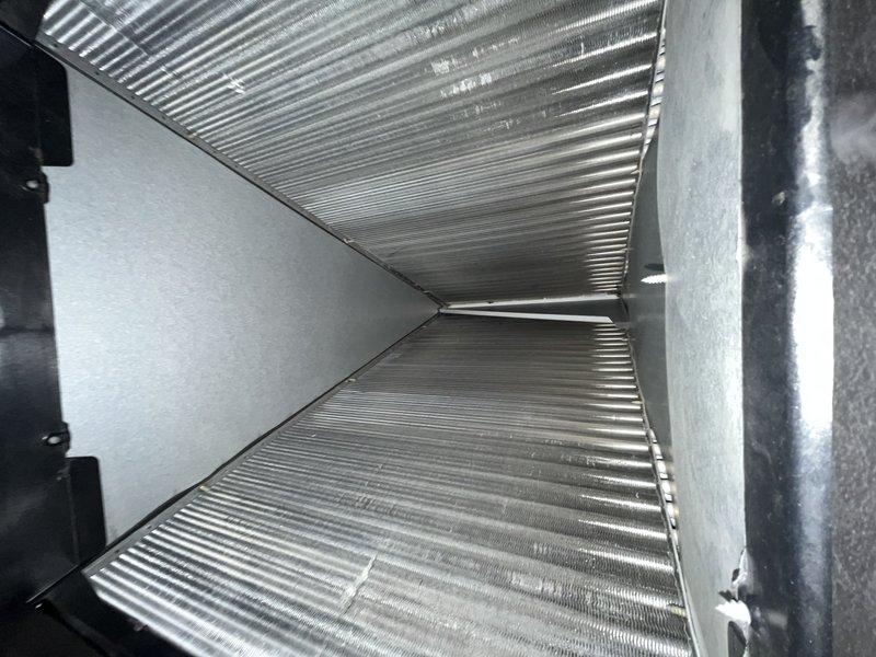 Responded to no cooling complaint affecting entire home with 20-year-old Trane air conditioning system. Advised customer to power down AC unit to prevent potential compressor damage and allow for comprehensive diagnostic evaluation. Performed visual inspection of outdoor condensing unit and indoor air handler, documenting equipment nameplate data and internal component condition through photographic documentation for assessment purposes.