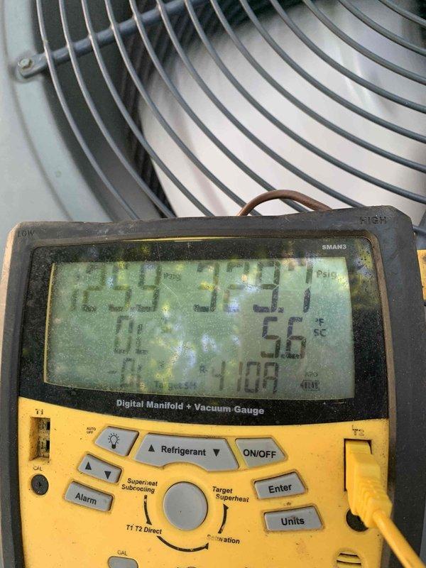 Responded to no cooling complaint affecting entire residence. Upon arrival, performed diagnostic evaluation on 26-year-old York condensing unit. Utilized digital manifold gauges to measure system pressures and temperatures, recording superheat and subcooling values to assess refrigerant charge and system performance. Inspection revealed TITAN PRO run capacitor (model TRCFD455) and associated electrical components within condenser unit. Evaluated compressor contactor, wiring connections, and capacitor functionality. Verified proper electrical connections and component operation. Tested condenser fan motor operation and confirmed adequate airflow through coil. System restored to proper cooling operation and verified temperature split across evaporator coil met manufacturer specifications.
