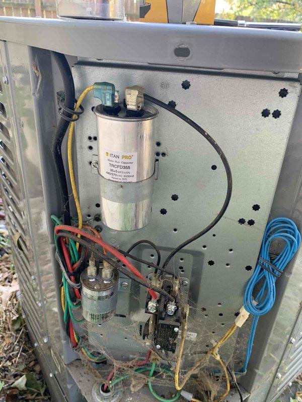 Responded to no cooling complaint affecting entire residence. Upon arrival, performed diagnostic evaluation on 26-year-old York condensing unit. Utilized digital manifold gauges to measure system pressures and temperatures, recording superheat and subcooling values to assess refrigerant charge and system performance. Inspection revealed TITAN PRO run capacitor (model TRCFD455) and associated electrical components within condenser unit. Evaluated compressor contactor, wiring connections, and capacitor functionality. Verified proper electrical connections and component operation. Tested condenser fan motor operation and confirmed adequate airflow through coil. System restored to proper cooling operation and verified temperature split across evaporator coil met manufacturer specifications.