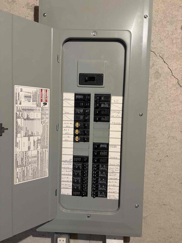 Responded to service call to inspect and diagnose three-way switch issue. Performed comprehensive electrical system evaluation including inspection of main electrical panel and meter installation. Verified all circuit breakers were properly labeled and functioning, confirmed main breaker operation, and documented panel condition showing organized circuit identification with mix of standard and specialty breakers. Inspected exterior meter box installation, verified digital meter operation and proper conduit mounting. System found to be in good working order with no immediate safety concerns identified. Documented findings with photographs for service records.