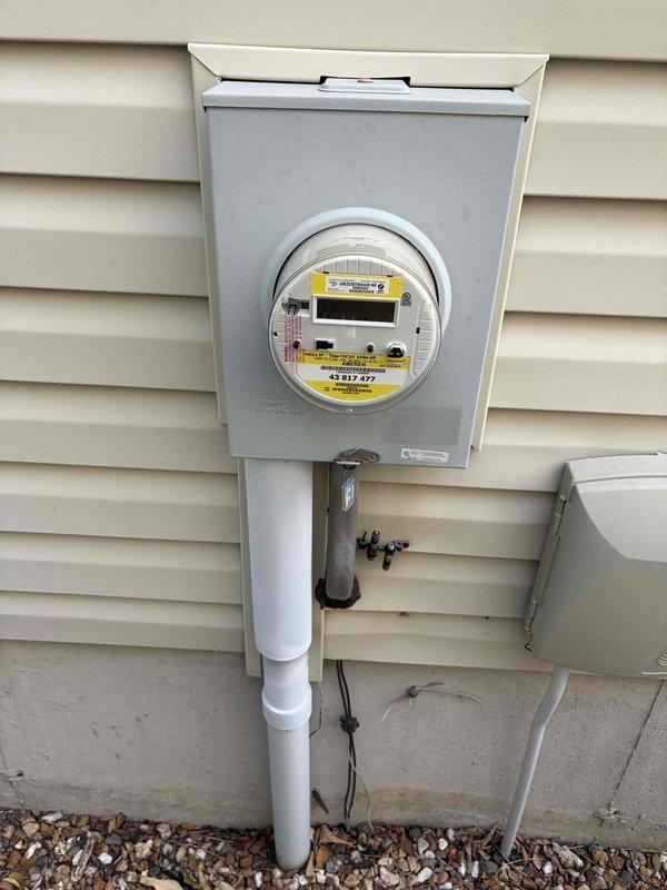 Responded to service call to inspect and diagnose three-way switch issue. Performed comprehensive electrical system evaluation including inspection of main electrical panel and meter installation. Verified all circuit breakers were properly labeled and functioning, confirmed main breaker operation, and documented panel condition showing organized circuit identification with mix of standard and specialty breakers. Inspected exterior meter box installation, verified digital meter operation and proper conduit mounting. System found to be in good working order with no immediate safety concerns identified. Documented findings with photographs for service records.