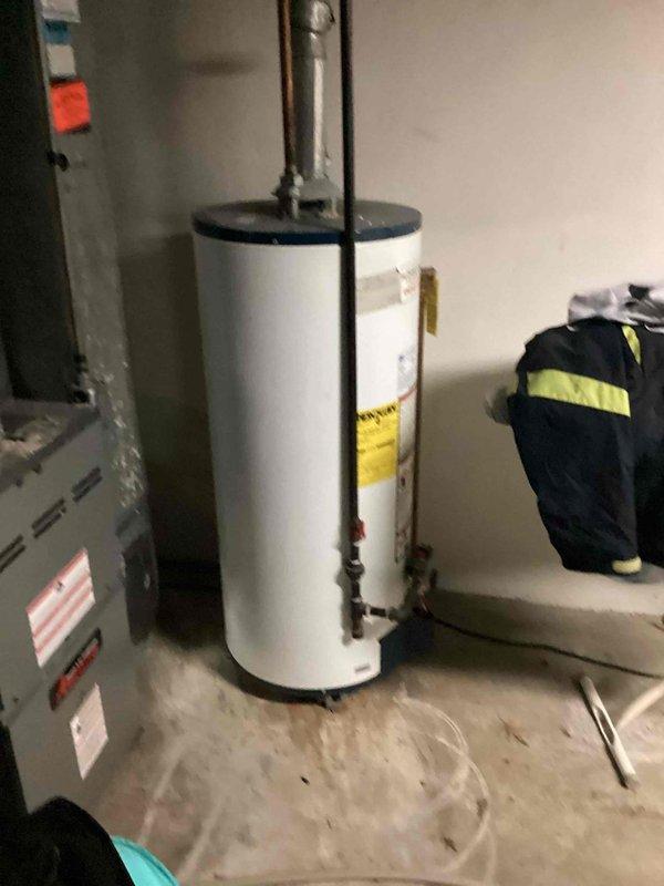 Responded to no cooling complaint on 10+ year old residential air conditioning system located at side of house. Upon arrival, provided courtesy call per special instructions and proceeded to basement mechanical room for diagnostic evaluation. System was operational but delivering room temperature air with no cooling capacity. Performed comprehensive system assessment including inspection of furnace, air handler, and associated components. Verified thermostat settings and confirmed call for cooling. Checked electrical connections, control board operation, and safety switches. Inspected condensate drainage system and refrigerant lines. Evaluated indoor coil condition and airflow characteristics. Documented equipment nameplate information and captured photographic evidence of installation for service records. System requires further diagnosis of outdoor condensing unit to determine root cause of cooling failure, which may include compressor malfunction, refrigerant leak, or electrical com
